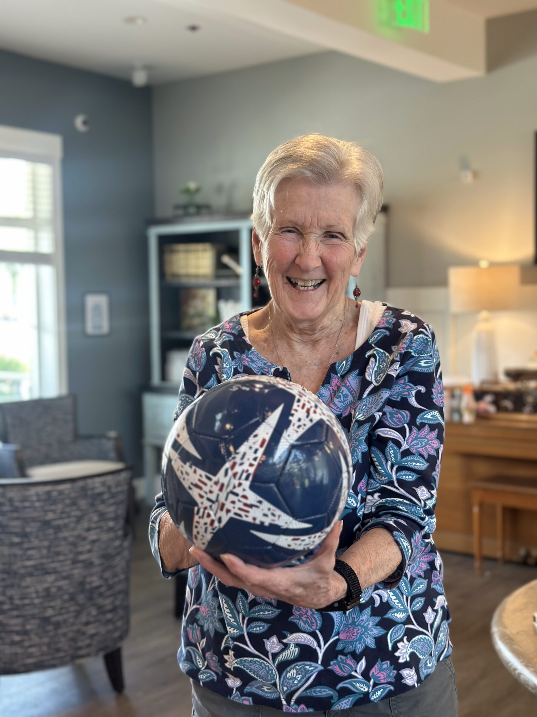 A resident enjoying an activity at Remember Me Senior Care