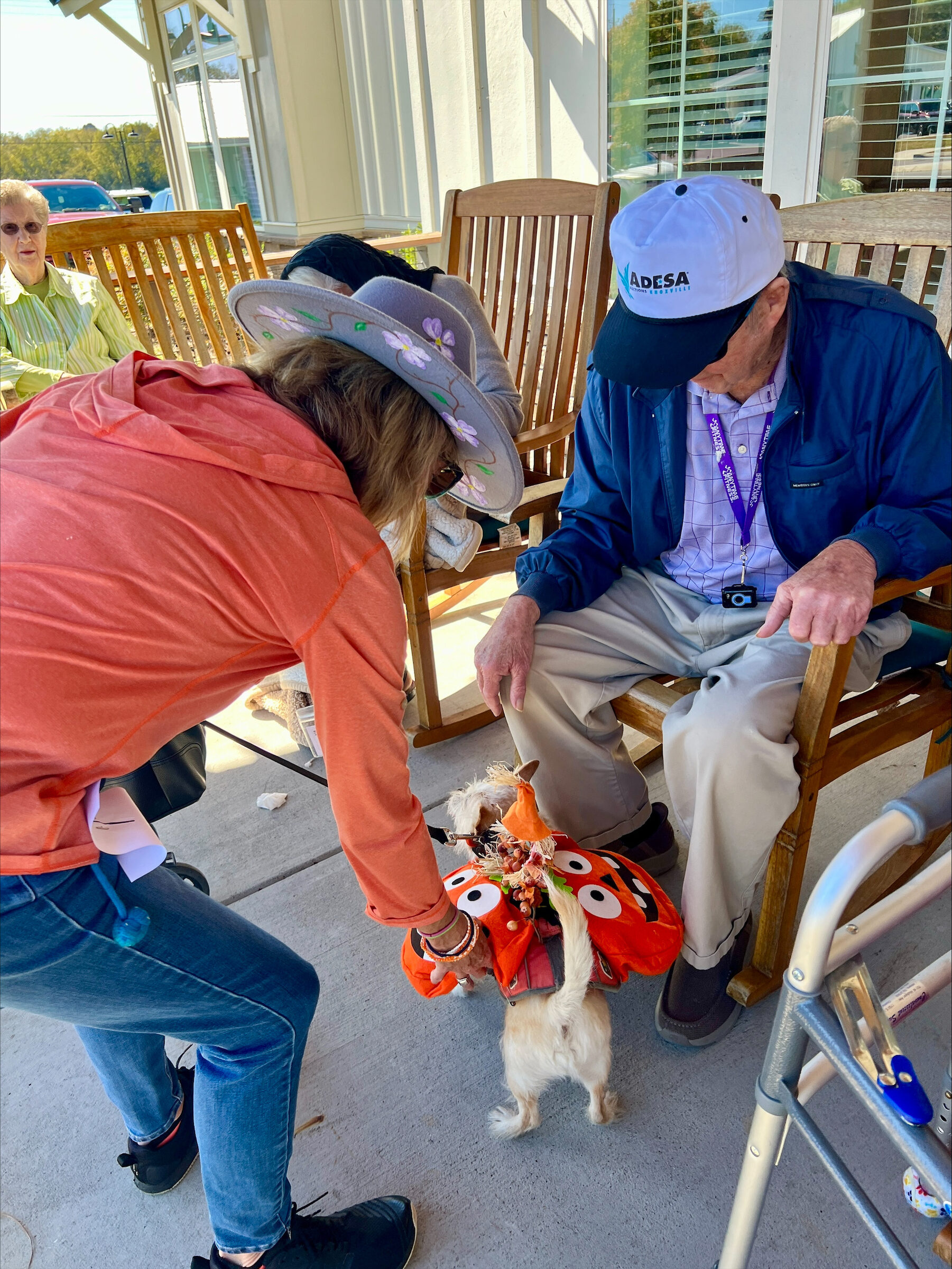 A resident enjoying the front porch at Remember Me Senior Care
